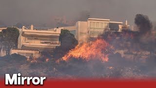 Cerberus heatwave Wildfires force thousands to flee seaside resorts outside Greek capital [upl. by Ennovoj]