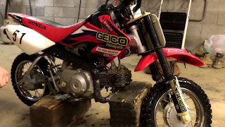 Changing the oil in the Honda CRF50 Part 1 [upl. by Homerus620]