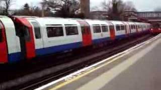 Two Piccadilly line tube trains arrive at Osterley station [upl. by Eldwun]