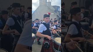 Dufftown Highland Games massed pipe bands march from Games field to Clock tower 29th July 2023 [upl. by Ile]