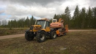 Pulling Samsung excavator with JCB Fastrac 155 [upl. by Zohar616]