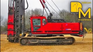 PILE DRIVER MACHINE WITH IMPACT HAMMER ERECTING CONCRETE FOUNDATIONS [upl. by Calendre]