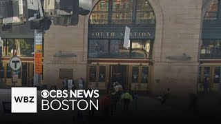 Falling metal narrowly misses people in front of Bostons South Station [upl. by Lunsford]