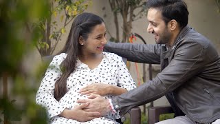 Pan shot of an excited pregnant woman telling her husband that  Indian Stock Footage  Knot9 [upl. by Crutcher524]