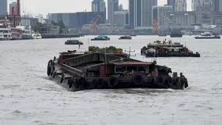 Cargo Barges travelling up and down the Huangpu River through Shanghai [upl. by Yornoc]