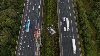 Shocking footage shows aftermath of lorry that plummeted off motorway bridge  SWNS [upl. by Awahsoj]