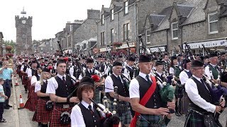 Chieftain leads almost 300 pipers amp drummers to the 127th Dufftown Highland Games in Moray Scotland [upl. by Adlanor]