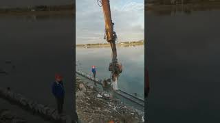 The process of driving cement piles for river cofferdams [upl. by Tedder952]