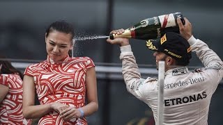 Stick a cork in it Lewis Formula One ace Lewis Hamilton sprays hostess girl in the face [upl. by Lowndes539]