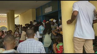 Voters force door of polling center amid delays in DR Congo elections  AFP [upl. by Thayne433]