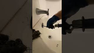 Clearing A Stopped Up Bathtub Drain  Hair and String [upl. by Litta]