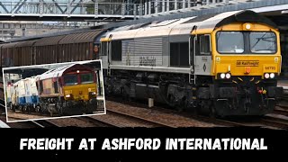 Freight trains at Ashford International  including 66793 in BR Railfreight Construction livery [upl. by Ailahtan]