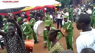 StFrancis high sch Kalongos brass band entertain at Opio Nicholas NurPri sch 14th graduation 🎓 [upl. by Ognimod139]