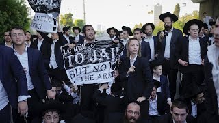 WATCH UltraOrthodox Jewish men block highway in Israel in protest against draft [upl. by Jamel681]