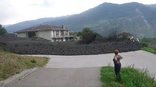 Mudslide barrels through Swiss town [upl. by Lynnett]