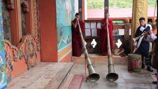 Monks playing dungchen or Tibetan Horns at Punakha Dzong Bhutan [upl. by Acireed]