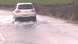 Volkswagen Tiguan driving through small flood [upl. by Marlena]