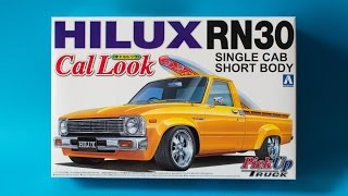 Aoshima 124 Toyota Hilux RN30 Cal Look Model Kit Unboxing And Review [upl. by Chandler]