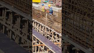 Workers try to put second layer of rebar for girder beam [upl. by Nnaitsirk]