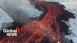 Iceland volcano Mesmerizing drone video shows bubbling lava swallow road near Blue Lagoon [upl. by Ddart]