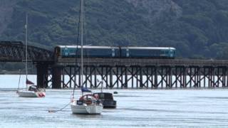 Barmouth Wales Arriva train DMU crosses River Mawddach Bridge 31 July 2015 [upl. by Ynehteb]