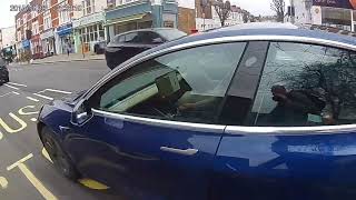 Tesla driver registration 26 H driving in Fulham holding mobile phone March 2024 [upl. by Fowler]