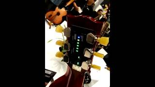 NAMM 2015 Gibson GForce automatic tuner demo [upl. by Ynttirb]