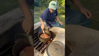 Braised pork shoulder over the campfire🔥 outdoorcooking camping bushcraft outdoors dutchoven [upl. by Royal]