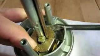 How to remove the lock cylinder from a Kwikset SmartKey entry knob [upl. by Levan633]