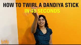 How To TwirlSpin a DandiyaRaas Stick Tutorial in 45 Seconds  How to spin a stick [upl. by O'Connor]