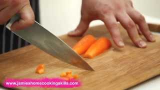 Chopping a carrot  Jamie Olivers Home Cooking Skills [upl. by Lehcir89]