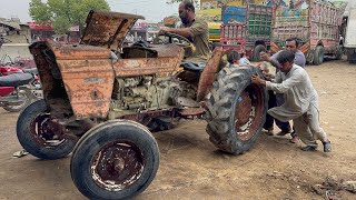 An expert mechanic repairs a rusty tractor that has been left in the rain for years [upl. by Ahsotan72]