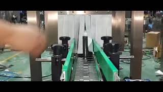 Automatic bottle cap pressing shrink sleeve label applicator [upl. by Harim]