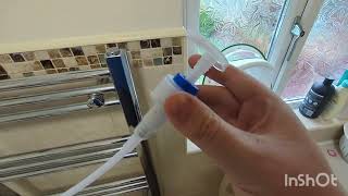 Add inhibitor to central heating system via a Towel Rail  drain using a soap pump [upl. by Ahtebbat]