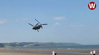 Moment lowflying Chinook helicopter thunders over Welsh beach [upl. by Nate]