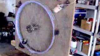 Pendulum on Bicycle Wheel Swung by Impulse Coil [upl. by Iseabal127]