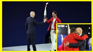 Zinedine Zidane passes torch to Rafael Nadal during starstudded Paris Olympics 2024 openingceremony [upl. by Rawdan]