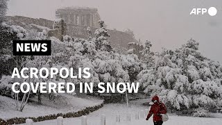 Snow covers Athens Acropolis  AFP [upl. by Neelasor]