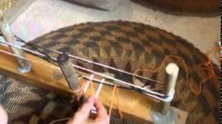 Adding string heddles as you wind a warp for backstrap weaving [upl. by Folly]