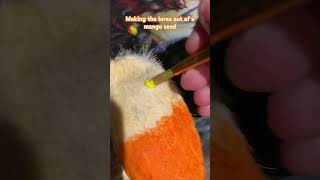 Making the Lorax out of a mango seed food thelorax craft funny cute [upl. by Etka782]