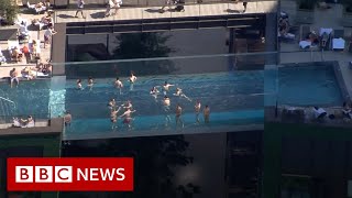 Worlds first floating pool suspended between London tower blocks  BBC News [upl. by Kumler]