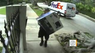 On tape Apparent FedEx worker throws box over fence [upl. by Debbie]