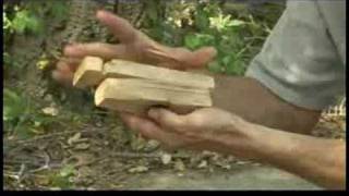 Starting a Fire With a Bow Drill Fire Starter  Making a Bow Drill Fireboard [upl. by Yecniuq]