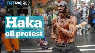 Oilcovered protester performs the Haka [upl. by Ehgit]