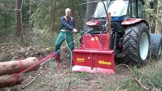 Steyr 370 Kompakt mit Uniforest Seilwinde beim Holz rücken winching firewood with a forestry winch [upl. by Fortunna]