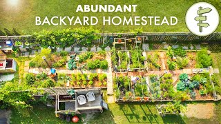 Couples Amazing Backyard Homestead Produces TONS of Food in the City  FULL GARDEN TOUR [upl. by Ibmab]