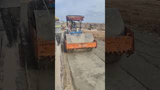 The workers help watering for roller compact mixed stone [upl. by Elokin]