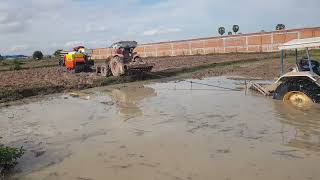 Machinery 4610 FORD tractor was stucked and pushes by Kubota M6040SU tractor bulldozer dumptruck [upl. by Feirahs]