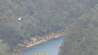 Helicopter dumping water in a forest Mulgoa New South Wales Australia A U [upl. by Anear522]