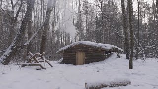 hiding in a huge dugout during a snow storm spending the night in bushcraft shelter [upl. by Loredo]